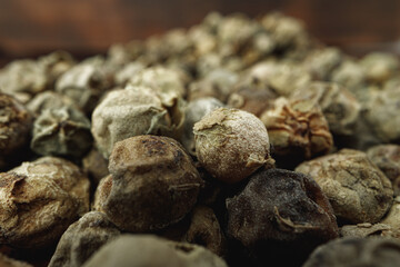 Macro photo of.green peppercorns on table