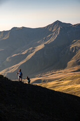 Fototapeta premium Two young women hiking on Grammos mountain