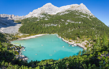 colorful green water of lake Sorapis in italian dolomite landscape