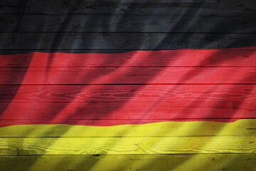 Germany - German National Flag on wooden Texture Background