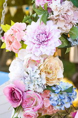 Close up floral arbor for wedding decoration. Pink roses bouquet in arch composition for valentines day card.