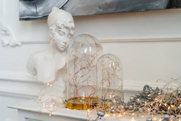 Sculpture and New Year garland, light holiday decor