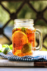 The glass of iced tea on wooden table. Cuba Libre or long island cocktail