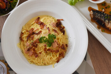 Top view Carbonara spaghetti in white plate Soft focus