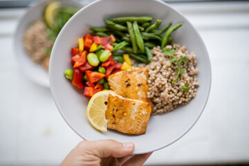 Salmon and buckwheat dish with green beans and tomato