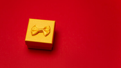 Flat lay image colorful box gift present bright design isolated on red background. Concept for lover in Valentine's Day, Birthday, New Year or Christmas. Empty copy space