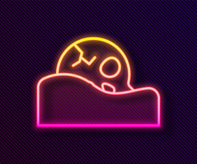 Glowing neon line Human skull in the ground icon isolated on black background. Vector.