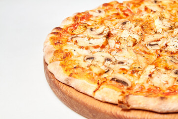 Fresh pizza with bacon, mushrooms and cheese on a light background. Close-up, selective focus