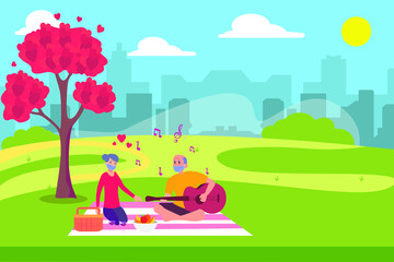 Obraz na płótnie Canvas Happy senior couple wearing face mask and having picnic together while playing guitar at the park with heart shape symbol