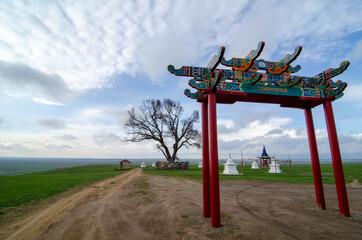 Pagoda and ritual drum and stupa with Buddhist symbols. Location Republic of Kalmykia