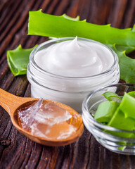 natural aloe vera cream on a dark rustic wooden background