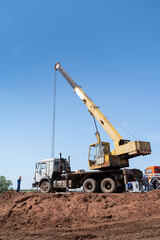 Truck crane at a construction site. The picture was taken in the summer in Russia