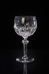 Lead cut crystal stemware isolated on black background.