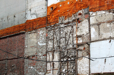 Old abandoned destroyed brick and concrete wall