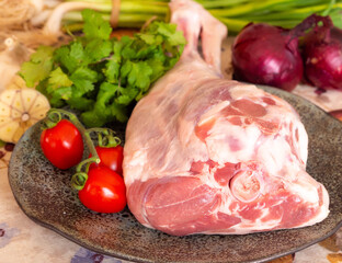 Fresh and raw meat. Leg of lamb on wood background