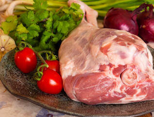 Fresh and raw meat. Leg of lamb on wood background
