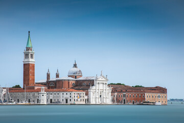 Fototapeta premium San Giorgio Maggiore Venice Italy photographed from over the grand canal to show the island, churches and buildings. 