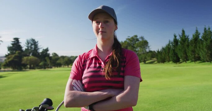Portrait of caucasian female golf player looking at camera and smiling