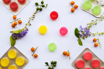 cough sore throat pastille colorful extract from herbal with flower arrangement flat lay style on background white 