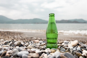 Fototapeta na wymiar bottle of water on the beach