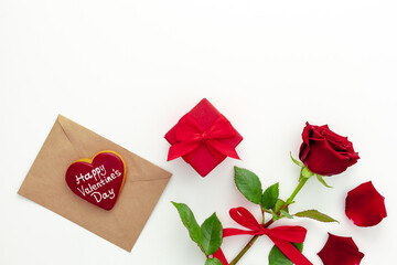 Valentine's Day. Red rose with a ribbon, love letter and red box.