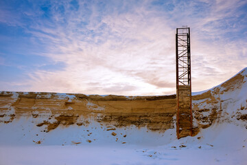 Mining of sand in the winter. Abandoned Sand quarry. Construction site for extraction of sand and gravel.
