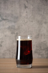 ice americano coffee on wood table in coffee shop loft style