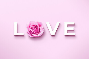 Love text with a pink Rose