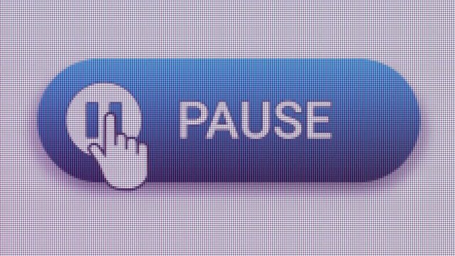Pause Button Click Extreme Close Up Front View 
Temporarily stopped reproduction of video or audio files.