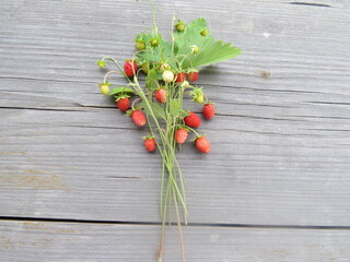 red berries on wooden table