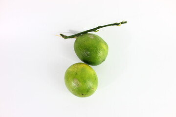 immature lemon in white background