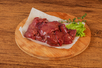 Raw chicken liver over board