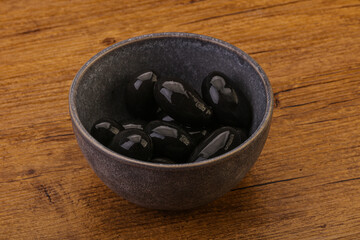 Pickled black olives in the bowl