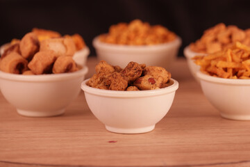 sing bhujia in white bowl,Indian Snack, savory,nimco in Mixture namkeen, Aloo sev And Round Shaped Yellow Snack,Namkeen, Farsan,