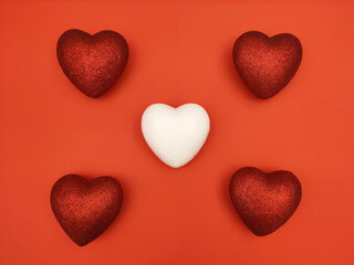 Red and white hearts on red background
