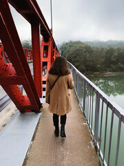 person walking on bridge