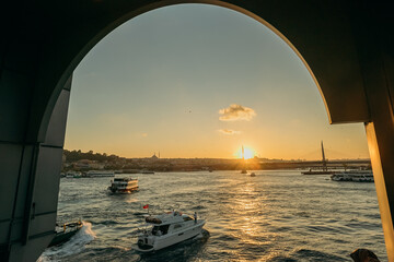 Tourist ship sails on the Golden Horn, scenic sunny beautiful waterfront  of Istanbul city at sunset in summer. - 403214151