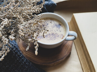 Cup of coffee and dry flowers