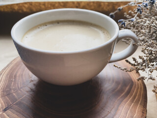Cup of coffee and dry flowers