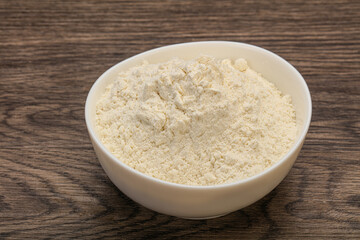 Wheat flour heap in the bowl