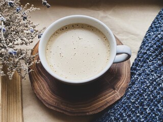 Cup of coffee and dry flowers