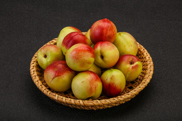 Sweet small nectarines in the basket