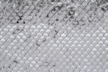 Snow-covered wire fence