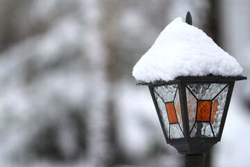 Snow-covered street lamp