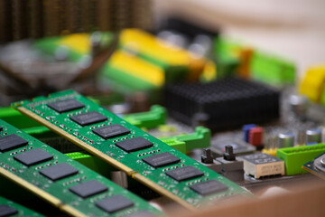 Computer parts. RAM cards and motherboard.