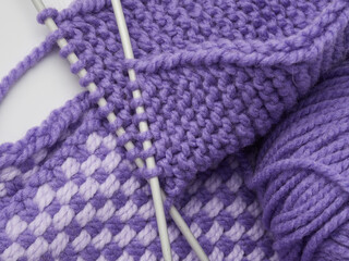Obraz na płótnie Canvas Needlework crochet, top view of yarn balls, flat spoon on light wood close-up