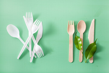 harmful plastic cutlery and eco friendly wooden cutlery. plastic free concept