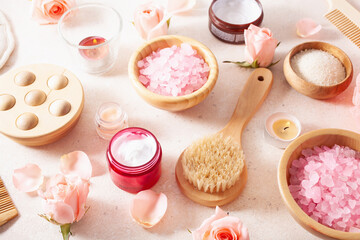 Fototapeta na wymiar skincare products and rose flowers. natural cosmetics for home spa treatment