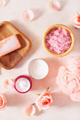 skincare products and rose flowers. natural cosmetics for home spa treatment