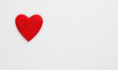 Red heart on a white background. Festive background. Minimalism. Copy space. St. Valentine's Day background